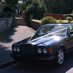 Yorkshire Wedding Cars - Midnight Blue Bentley Turbo RL, in front of church. Based near Harrogate, North Yorkshire